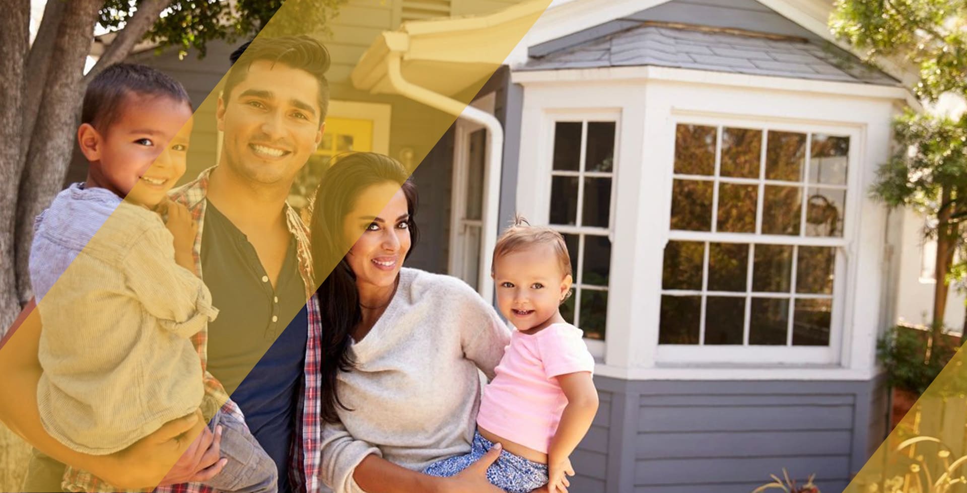 A family standing in front of their home.